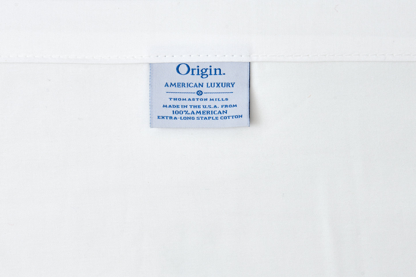 Label with 'Origin American Luxury' text on a white background