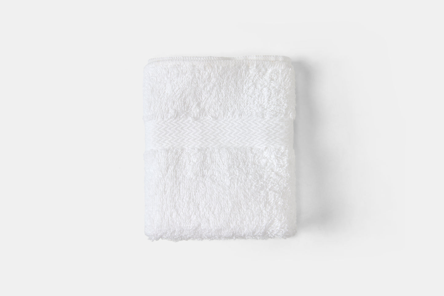 White textured square on a light gray background