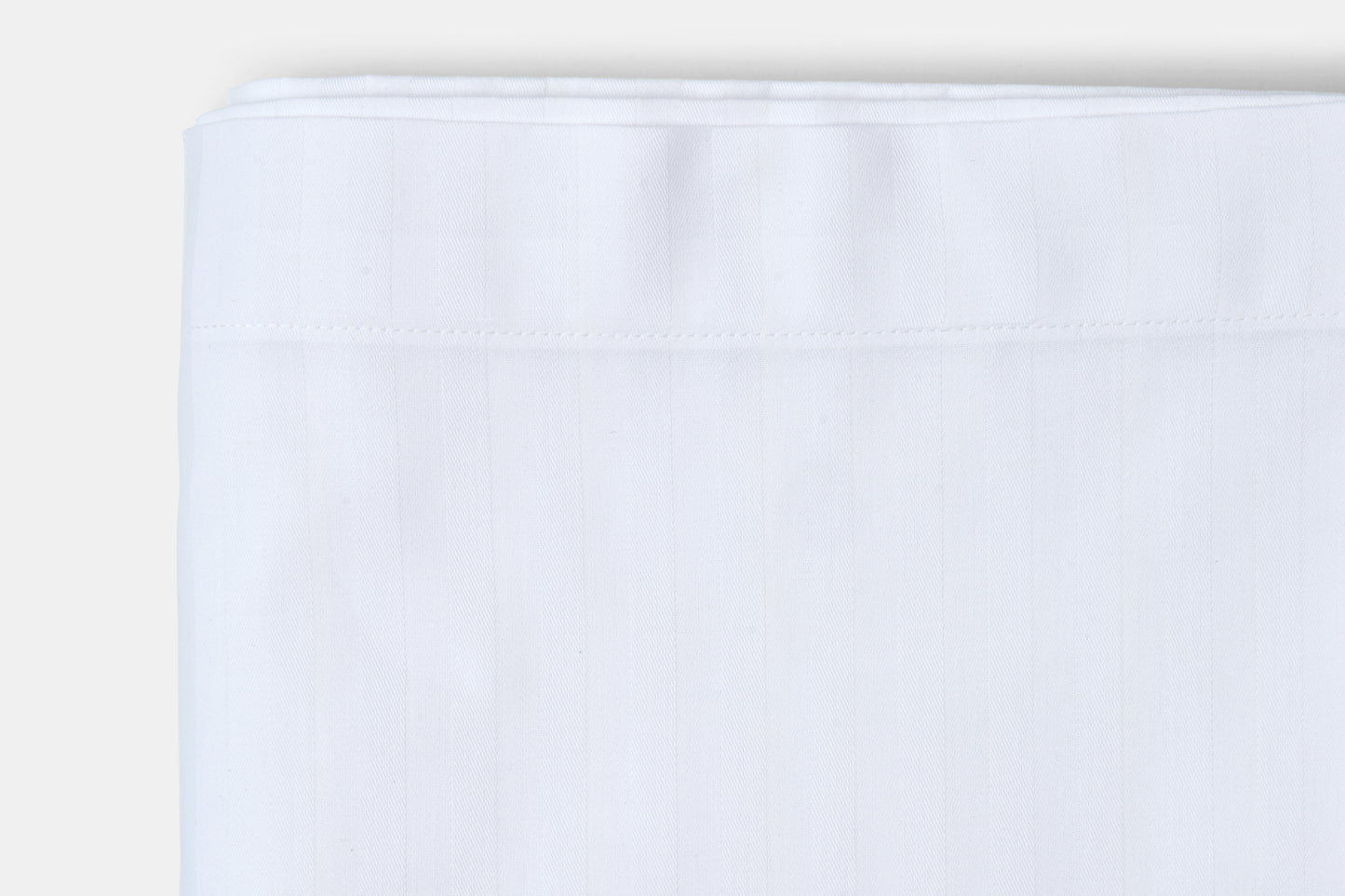 White fabric swatch on a light gray background