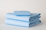 Thomaston Mills Pastel Light Blue sheets folded and stacked.