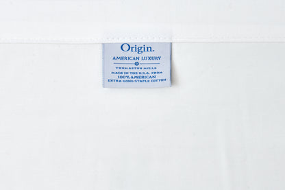 Label with 'Origin American Luxury' text on a white background