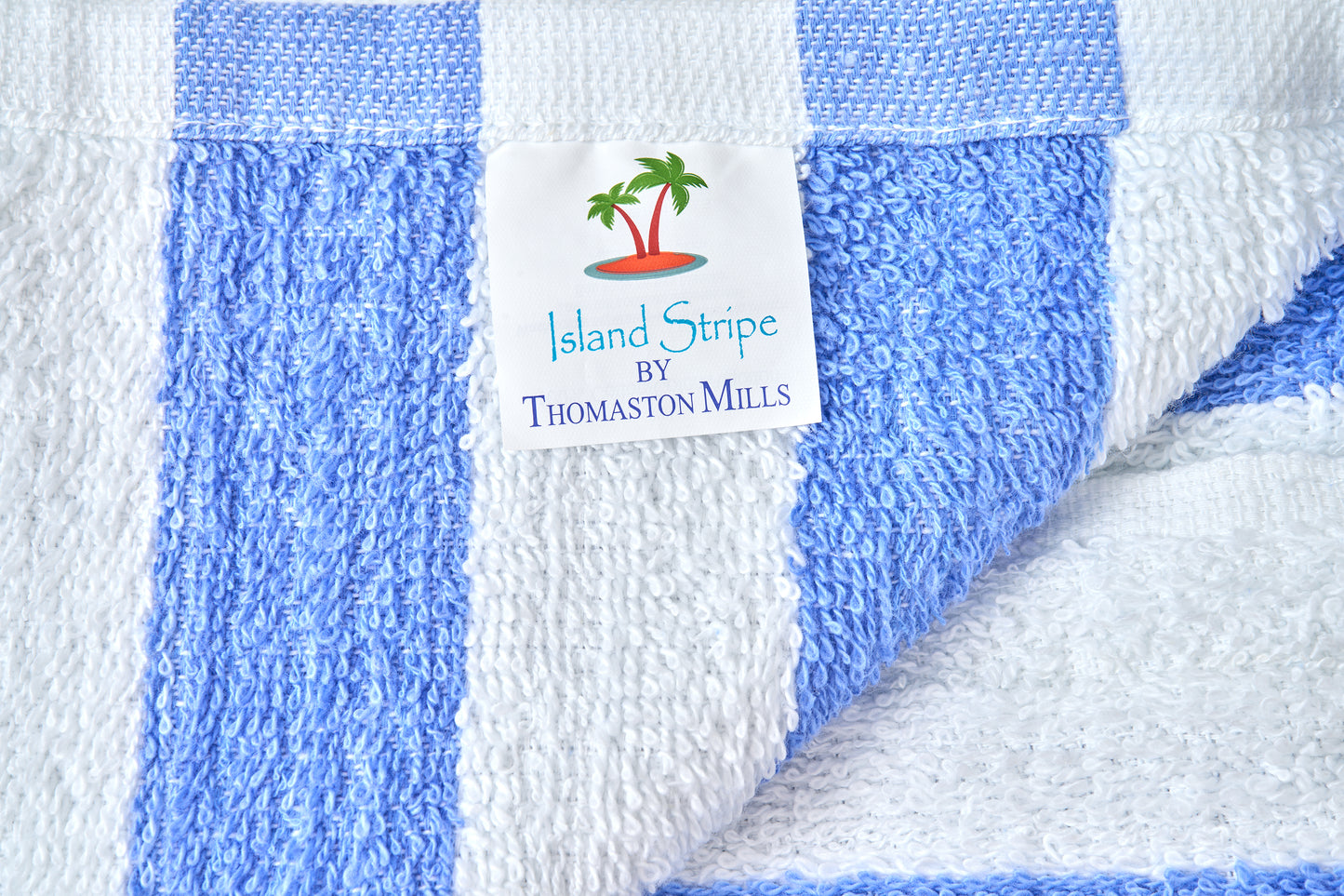 Blue and white striped towel with a label on a white background