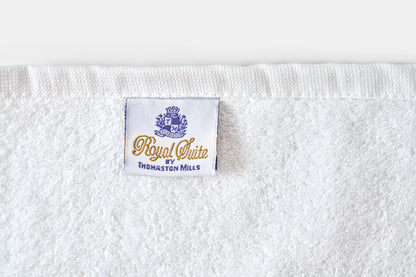 White towel with 'Royal Suite' label on a white background