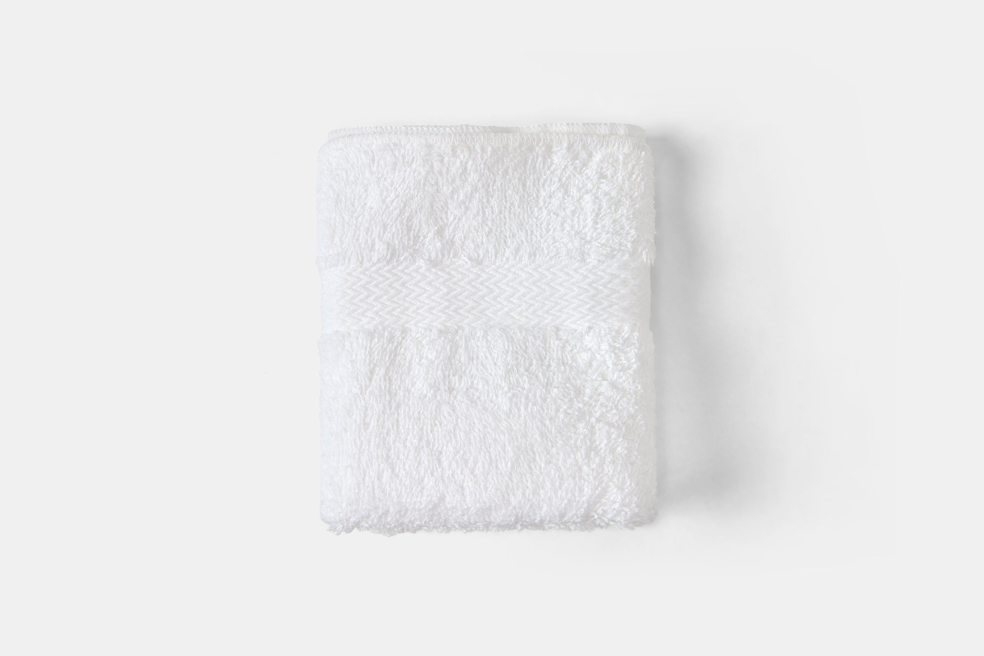 White textured square on a light gray background