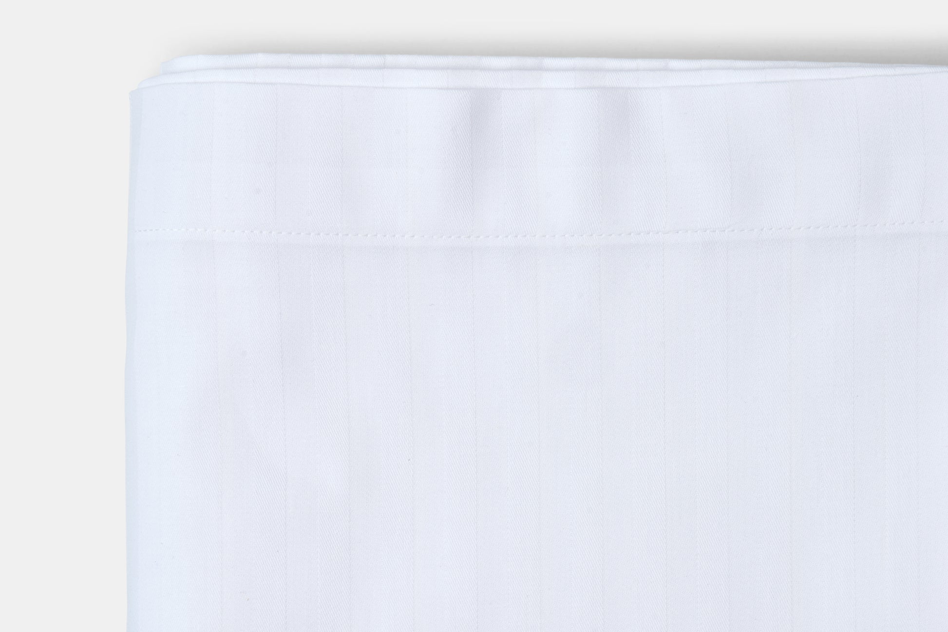 White fabric swatch on a light gray background