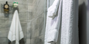 TM Plush By Thomaston Mills towels hanging in a bathroom.