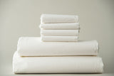 Thomaston Mills T-250 Royal Suite Sheets and Pillowcases folded and stacked.