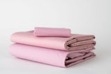 Thomaston Mills Pastel Rose sheets folded and stacked.