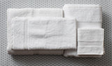 TM Plush by Thomaston MIlls towels and washcloths floded and stacked.